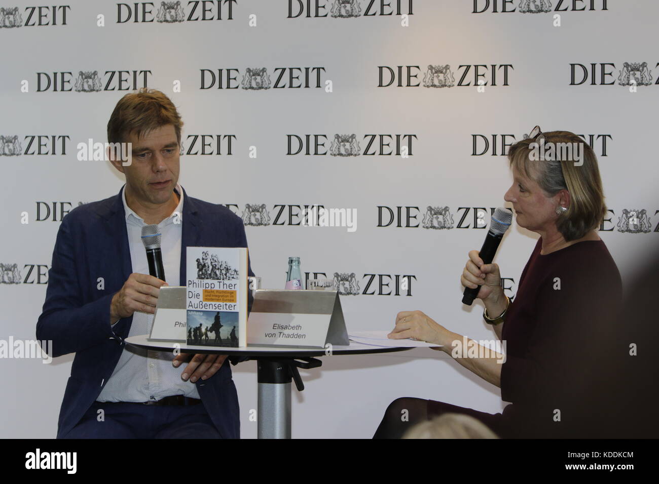 Frankfurt, Germany. 12th Oct, 2017. Austrian historian Philipp Ther gives an interview with the journalist Elisabeth von Thadden at the booth of the German national weekly newspaper Die Zeit at the Frankfurt Book Fair. The Frankfurt Book Fair 2017 is the world largest book fair with over 7,000 exhibitors and over 250,000 expected visitors. It is open from the 11th to the 15th October with the last two days being open to the general public. Credit: Michael Debets/Pacific Press/Alamy Live News Stock Photo