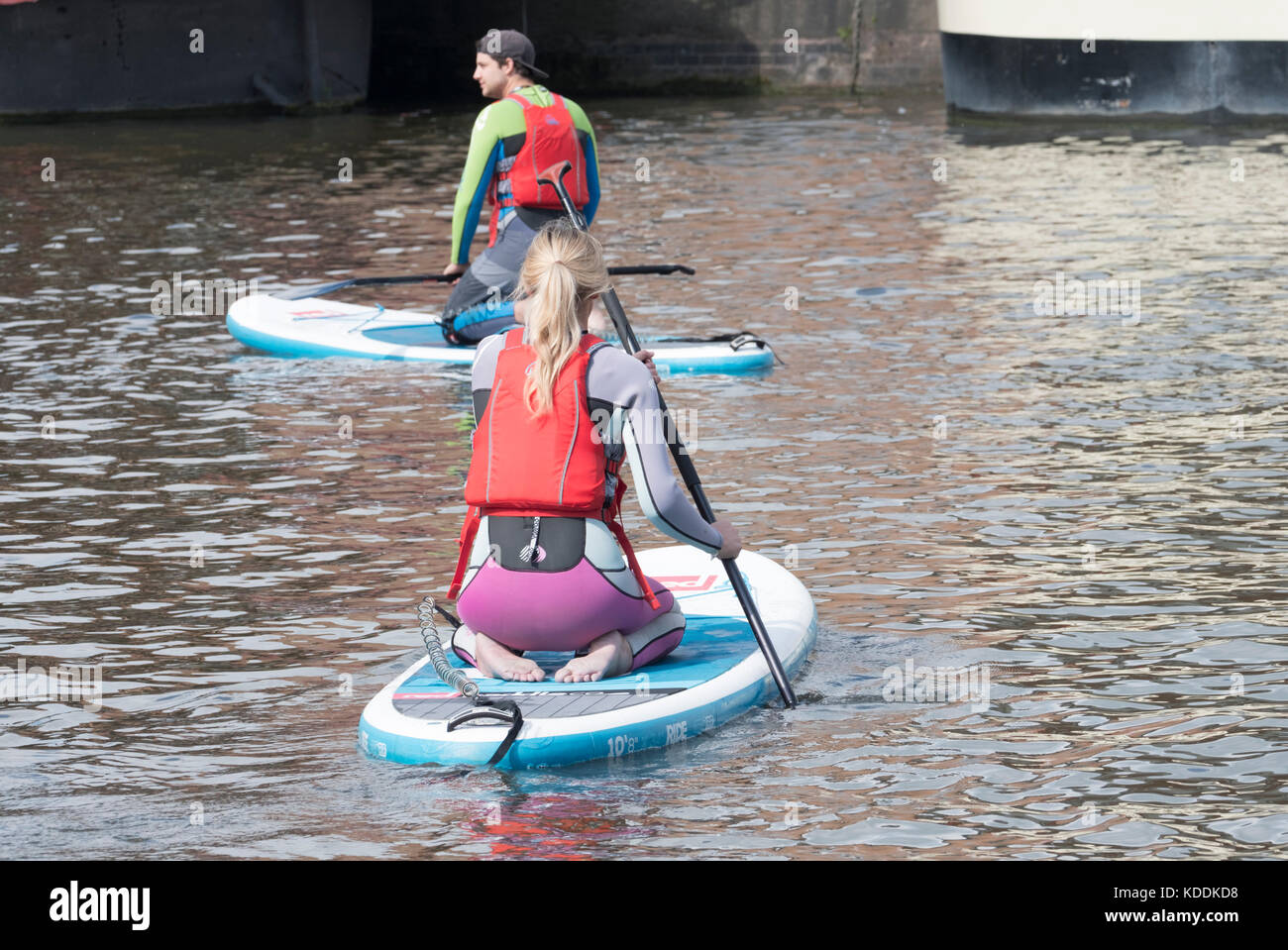 Paddle boarding in Gloucester docks Stock Photo Alamy