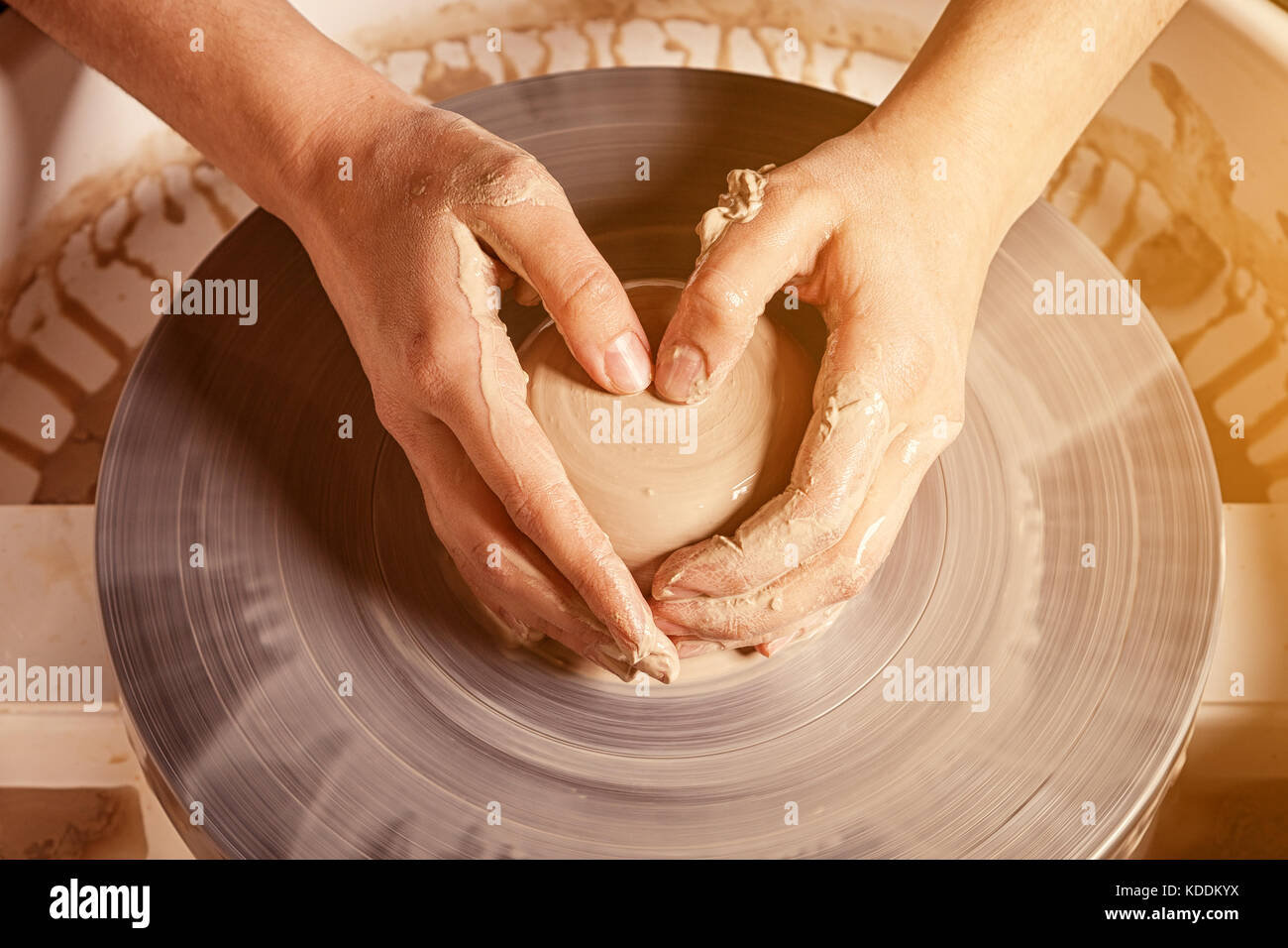 I dont mind getting my hands dirty. an unrecognizable woman molding clay on  a pottery wheel Stock Photo - Alamy