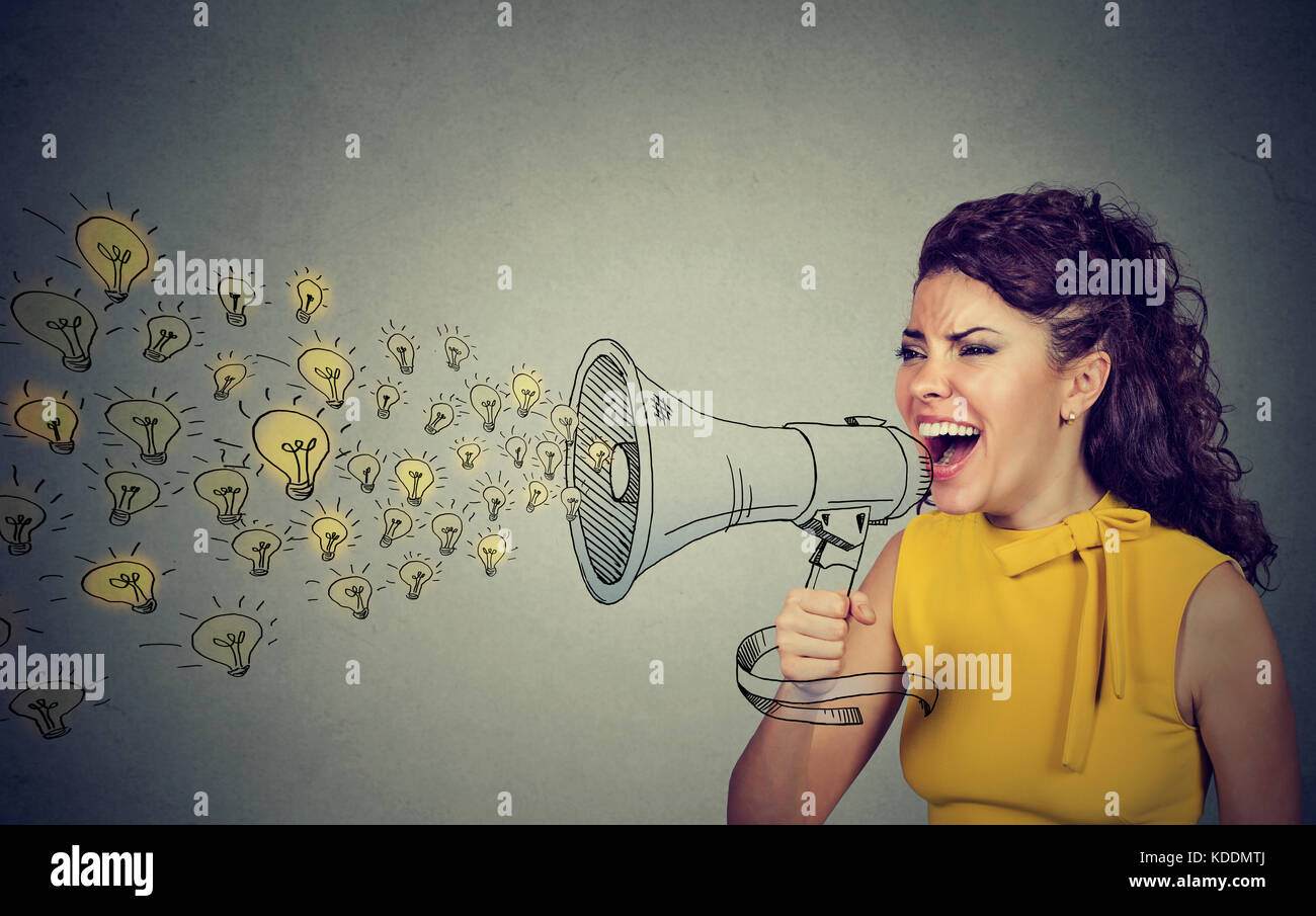 Woman screaming in megaphone isolated on gray background Stock Photo - Alamy