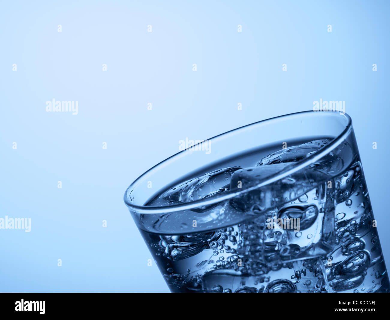 top of a glass of water with ice cubes on a light blue background Stock ...