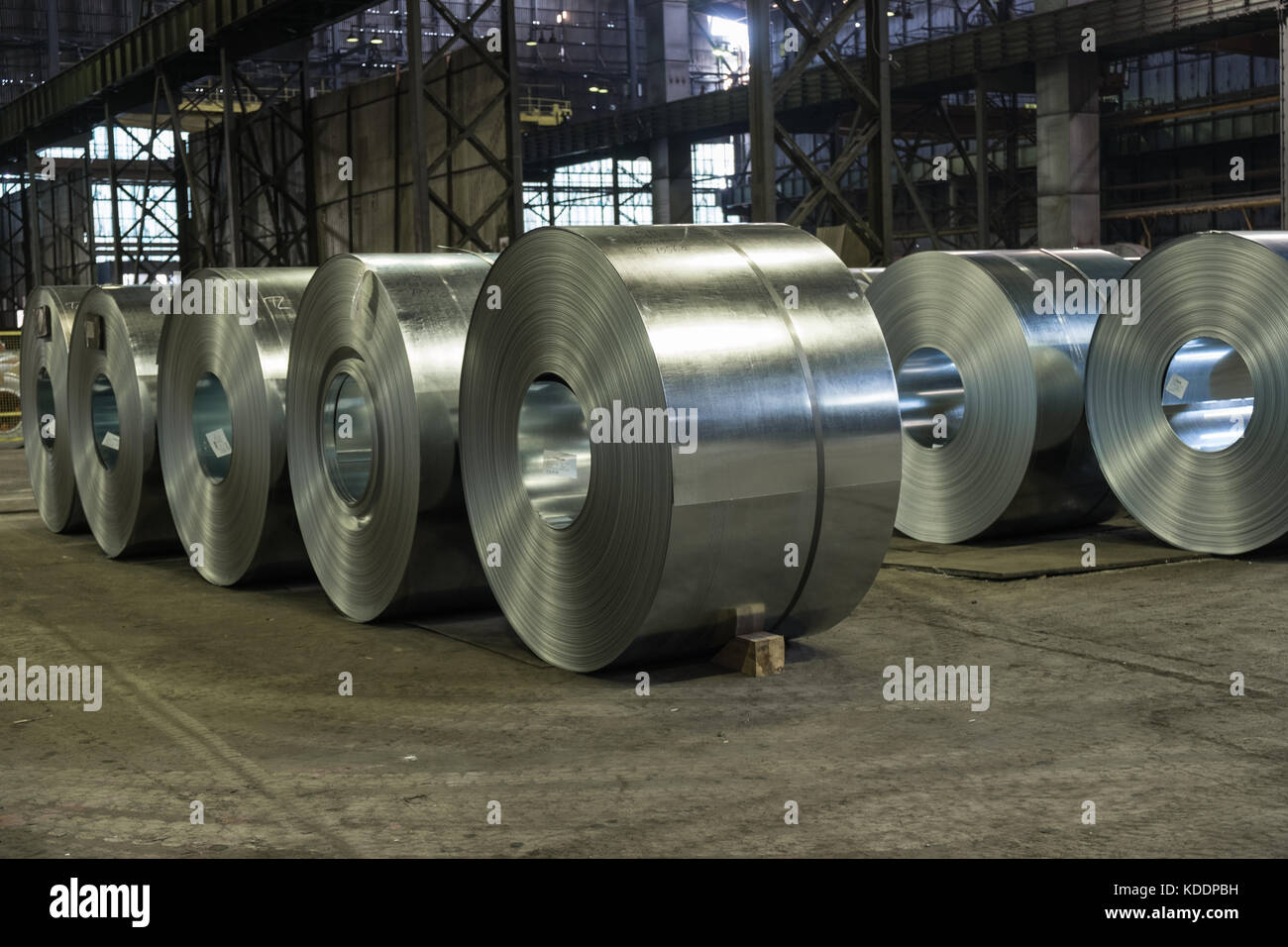 Raw steel coils ready for production in the steel mill Stock Photo