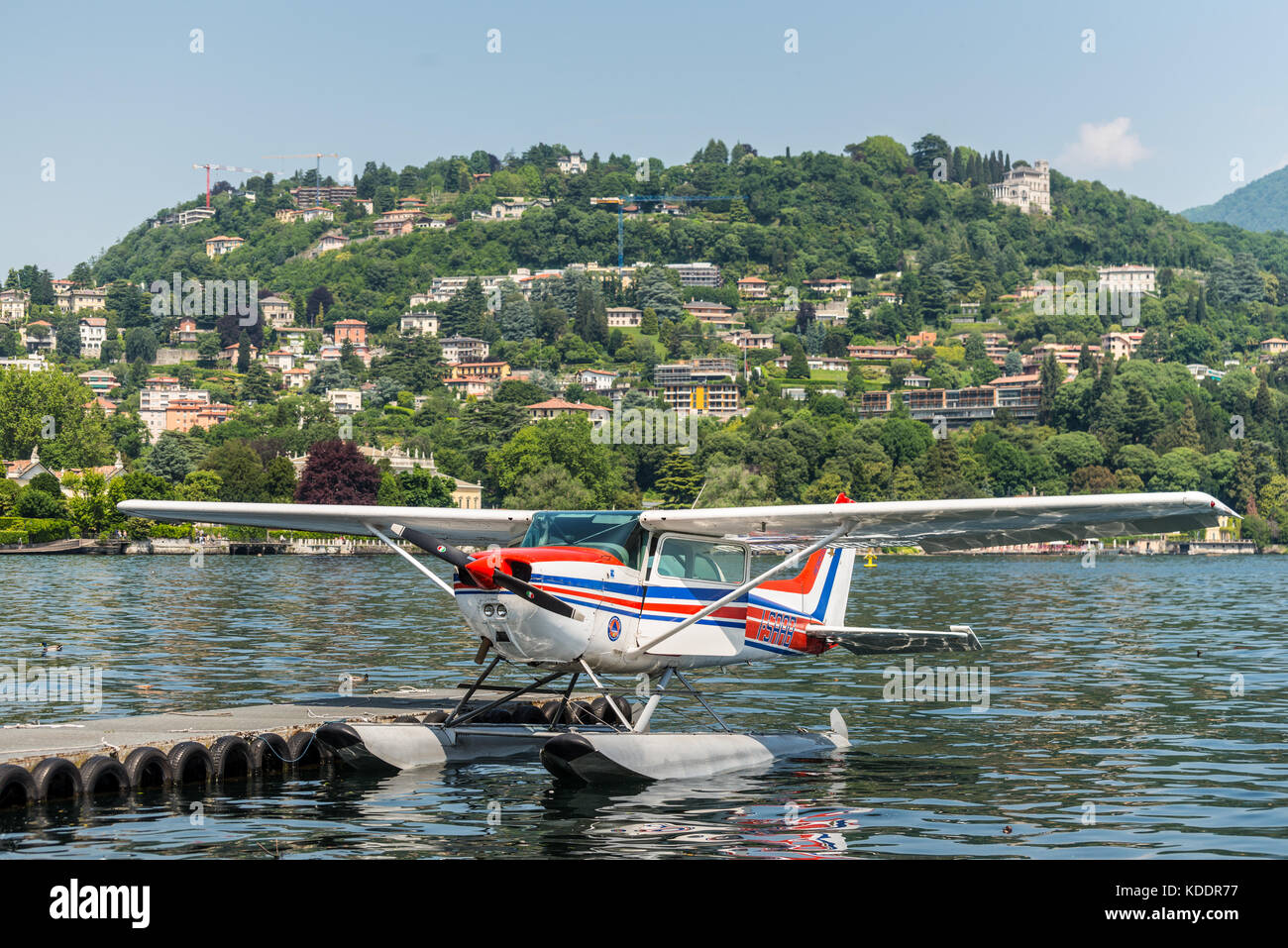 Como, Italy - May 27, 2016: A seaplane Cessna 172N Skyhawk 100 II docking on at water aerodrome of Como lake in Como City, Italy. Stock Photo