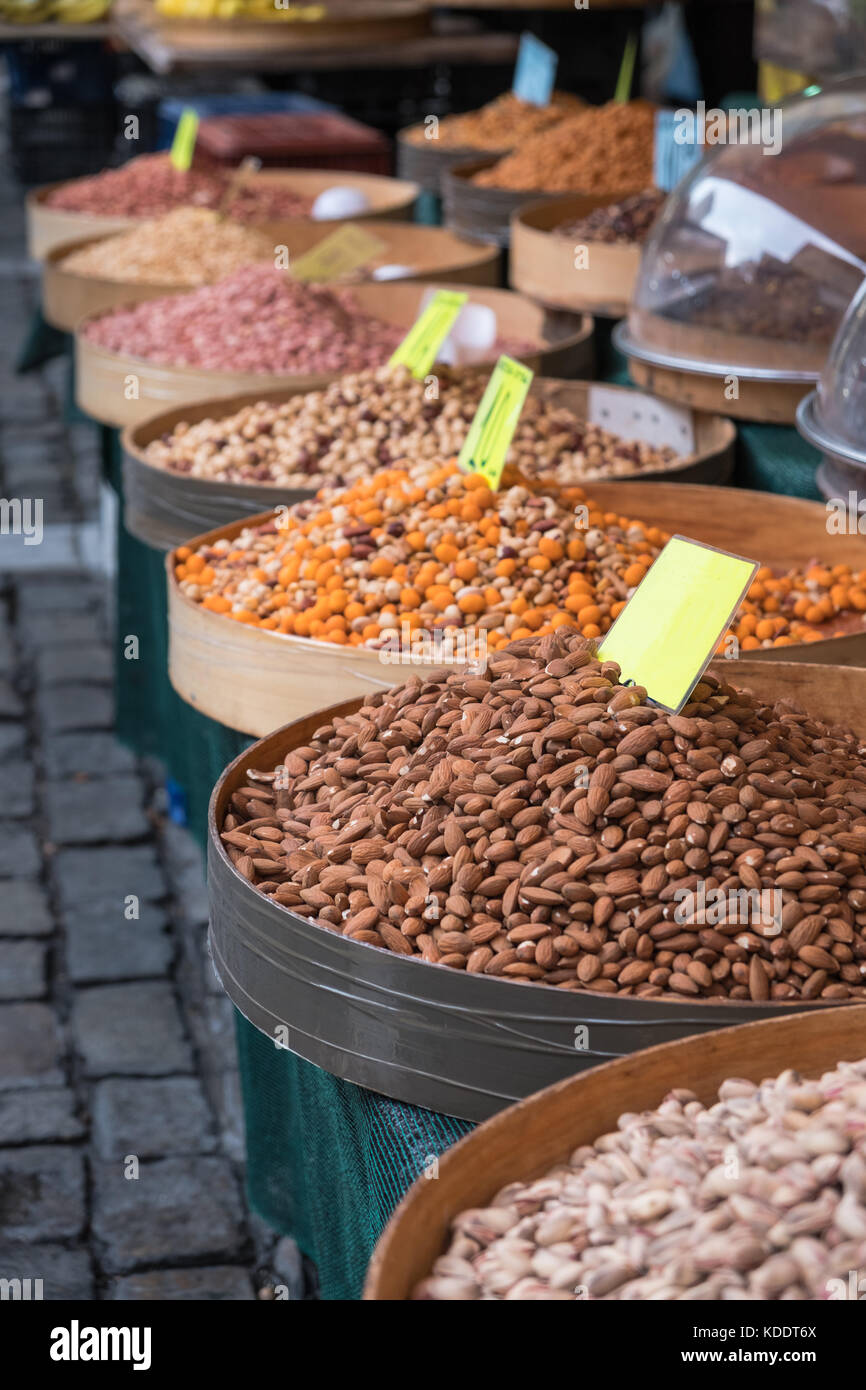 Various baked seeds and nuts in authentic Greek market with empty price