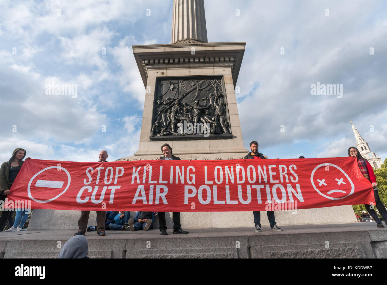 London, UK. 'Stop Killing Londoners: Cut Air Pollution' campaigners pose in Trafalgar Square on a day of protests in some of London's most polluted streets. Earlier they had briefly blocked Tower Bridge. Their series of protests took place as the London Assembly debated air quality measures and sent them the message that the 10,000 early deaths of Londoners is a health emergency and that the politicians need to prioritise the lives of Londoners over the special interests of the car and oil companies. Credit: Peter Marshall/Alamy Live News Stock Photo