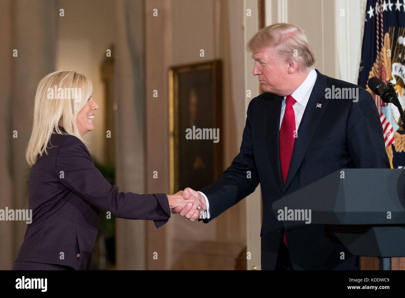 Washington, USA. 12th Oct, 2017. U.S. President Donald Trump (R) shakes hands with Kirstjen Nielsen during her nomination announcement at the White House in Washington, DC, the United States, on Oct. 12, 2017. Trump on Wednesday nominated Kirstjen Nielsen, an aide to White House Chief of Staff John Kelly, to be Secretary of Homeland Security. Credit: Ting Shen/Xinhua/Alamy Live News Stock Photo