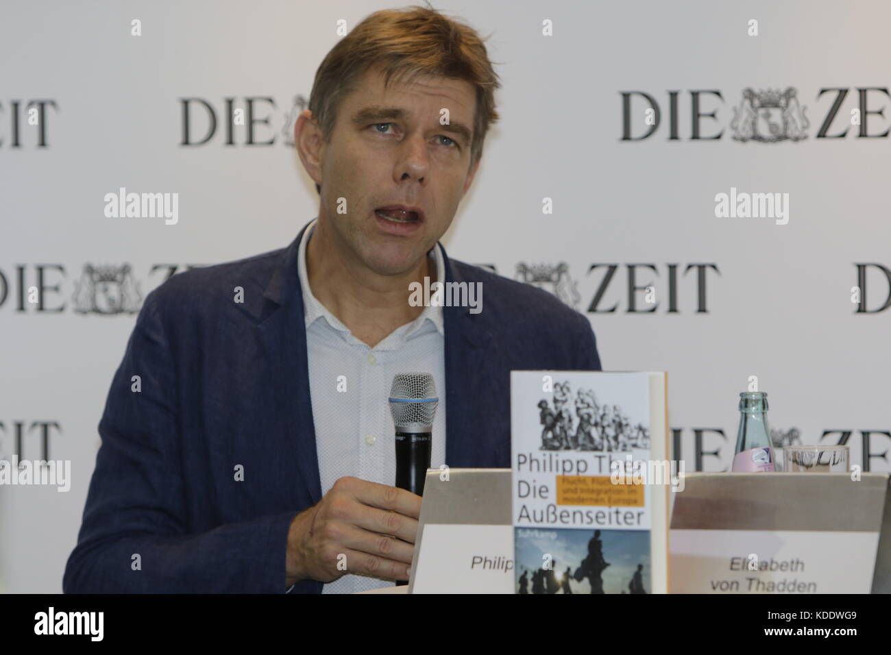 Frankfurt, Germany. 12th October 2017. Austrian historian Philipp Ther gives an interview at the booth of the German national weekly newspaper Die Zeit at the Frankfurt Book Fair. The Frankfurt Book Fair 2017 is the world largest book fair with over 7,000 exhibitors and over 250,000 expected visitors. It is open from the 11th to the 15th October with the last two days being open to the general public. Credit: Michael Debets/Alamy Live News Stock Photo
