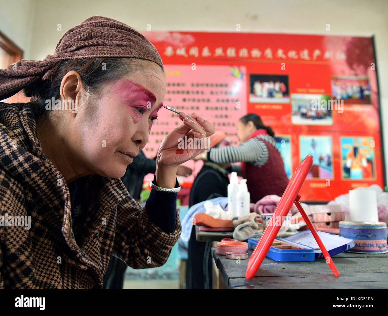 Shijiazhuang, China's Hebei Province. 12th Oct, 2017. An actress of Tongle Sixian Troupe prepares to perform Sixian, a local opera, at Nanke Village of Shijiazhuang City, capital of north China's Hebei Province, Oct. 12, 2017. Actually all actors of the troupe are local villagers, who practise and perform the opera during slack seasons in farming. Credit: Qie Lei/Xinhua/Alamy Live News Stock Photo