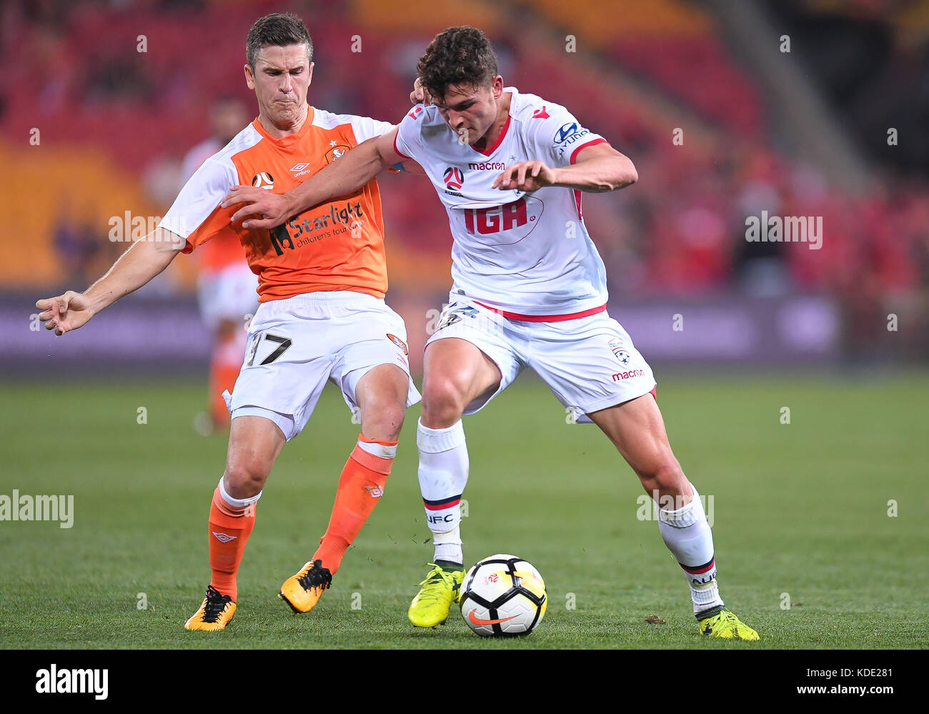 Brisbane, QUEENSLAND, AUSTRALIA. 13th Oct, 2017. Matt McKay of the Roar (#17, left) and George Blackwood of Adelaide (#14) compete for the ball during the round two A-League match between the Brisbane Roar and Adelaide United at Suncorp Stadium on October 13, 2017 in Brisbane, Australia. Credit: Albert Perez/ZUMA Wire/Alamy Live News Stock Photo