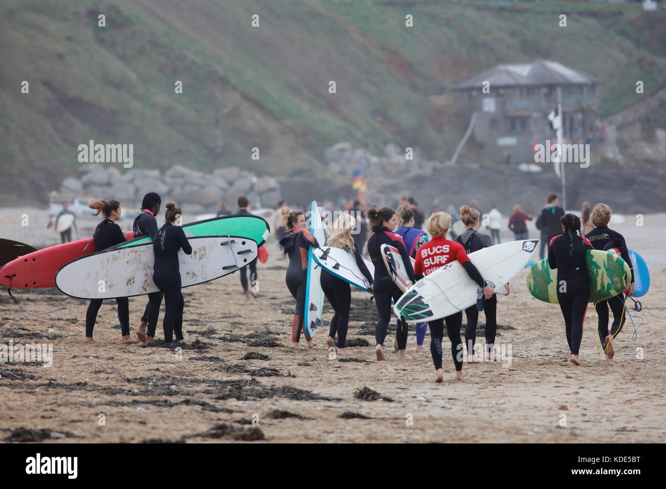 Fistral Beach, Newquay, Cornwall, UK. 13th October, 2017. Surfers take part in Day 1 heats of the British University and College Sports Surfing Competition. Numerous college surfers attended the event in fair weather conditions. Stock Photo