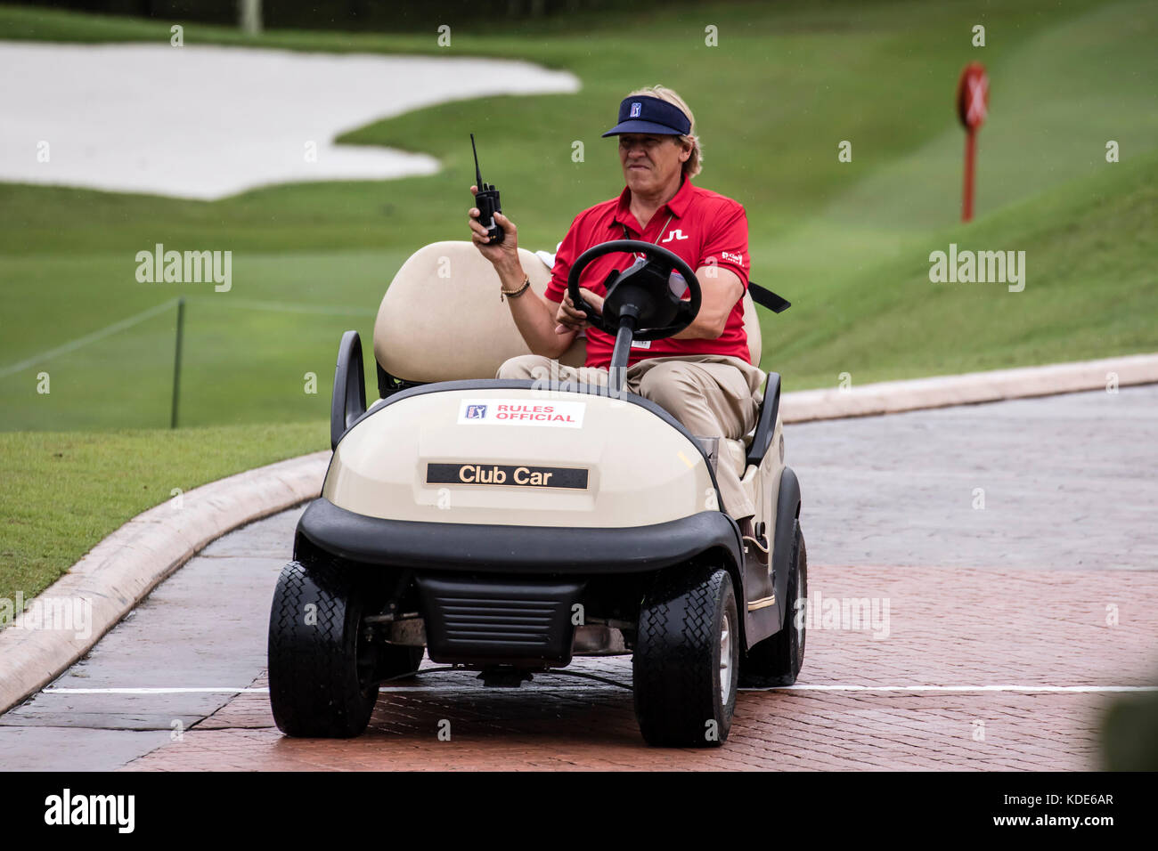 Kuala Lumpur, Malaysia. 13th October, 2017. PGA official waiting for instruction to suspend play as rain and thunder over shadow Round Two play at PGA CIMB Classic 2017 golf tournament in Kuala Lumpur, Malaysia. © Danny Chan/Alamy Live News. Stock Photo