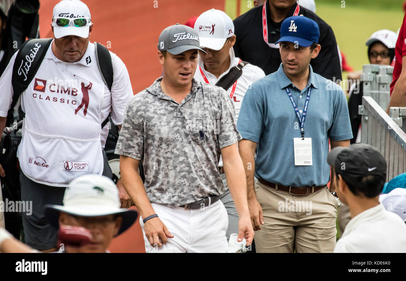 Kuala Lumpur, Malaysia. 13th October, 2017. USA Justin Thomas having a great time playing in the rain at the PGA CIMB Classic 2017 golf tournament in Kuala Lumpur, Malaysia. Thomas mob by his fans. © Danny Chan/Alamy Live News. Stock Photo