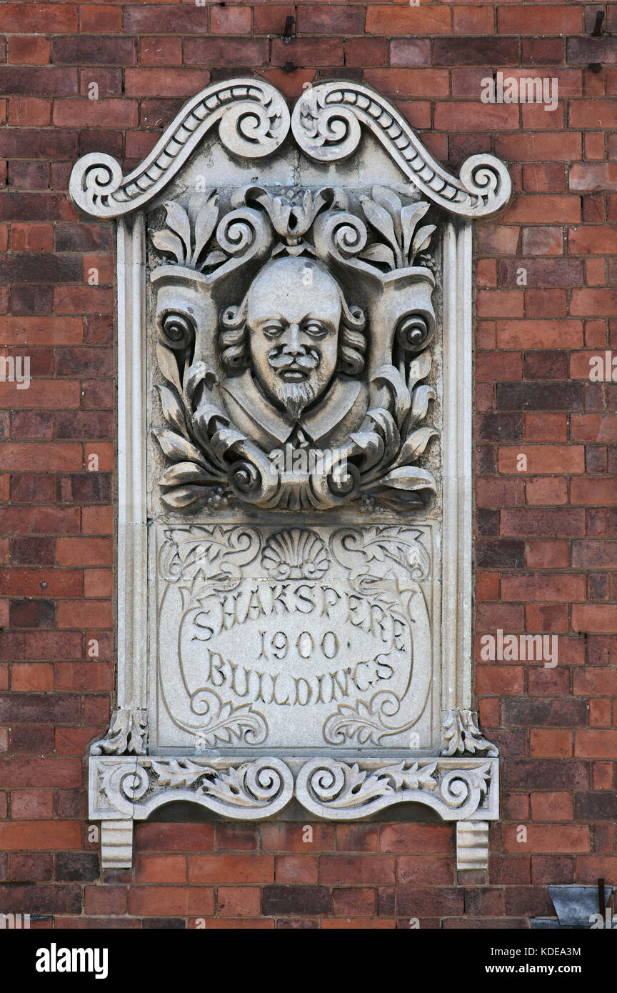 Stone carving of William Shakespeare on a first floor building wall in Lawford Road, Rugby. Stock Photo