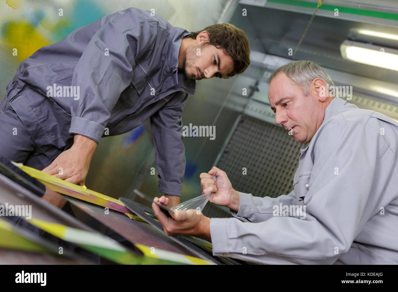 Factory Worker With Apprentice Stock Photo Alamy