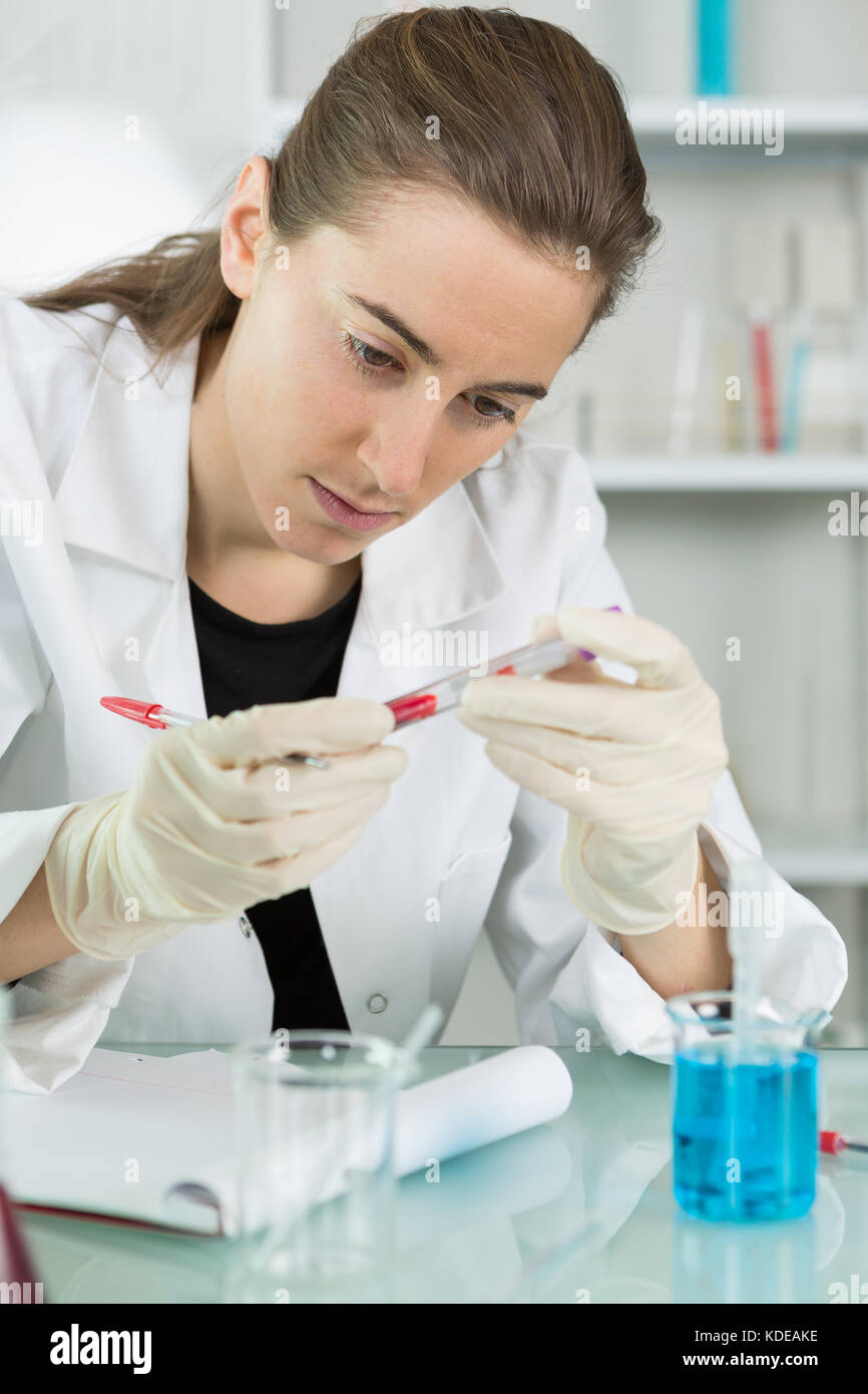 young female scientist loads samples for dna amplification Stock Photo