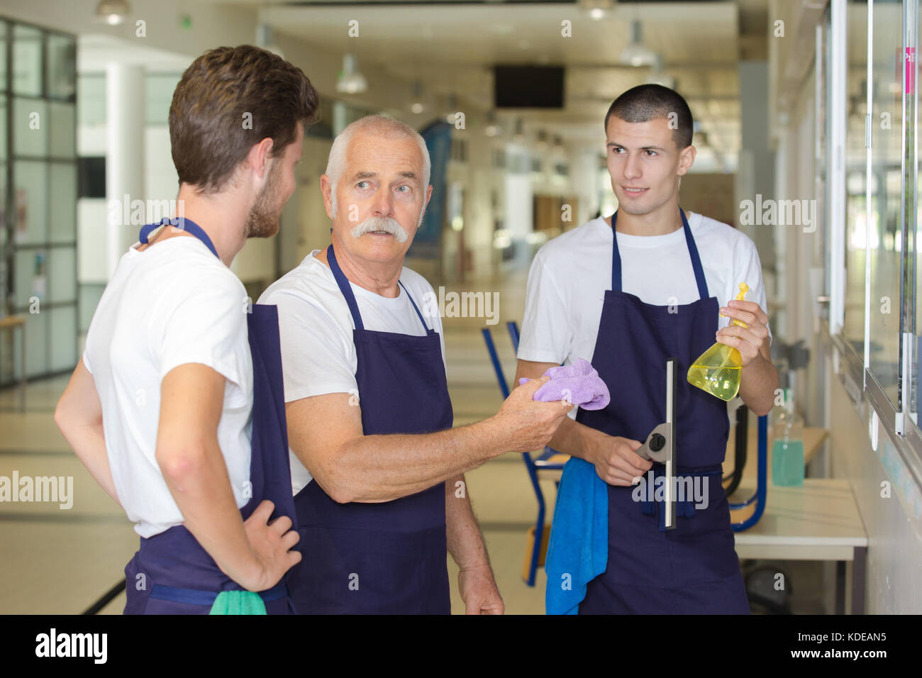 group of professional office cleaners having a break during work Stock