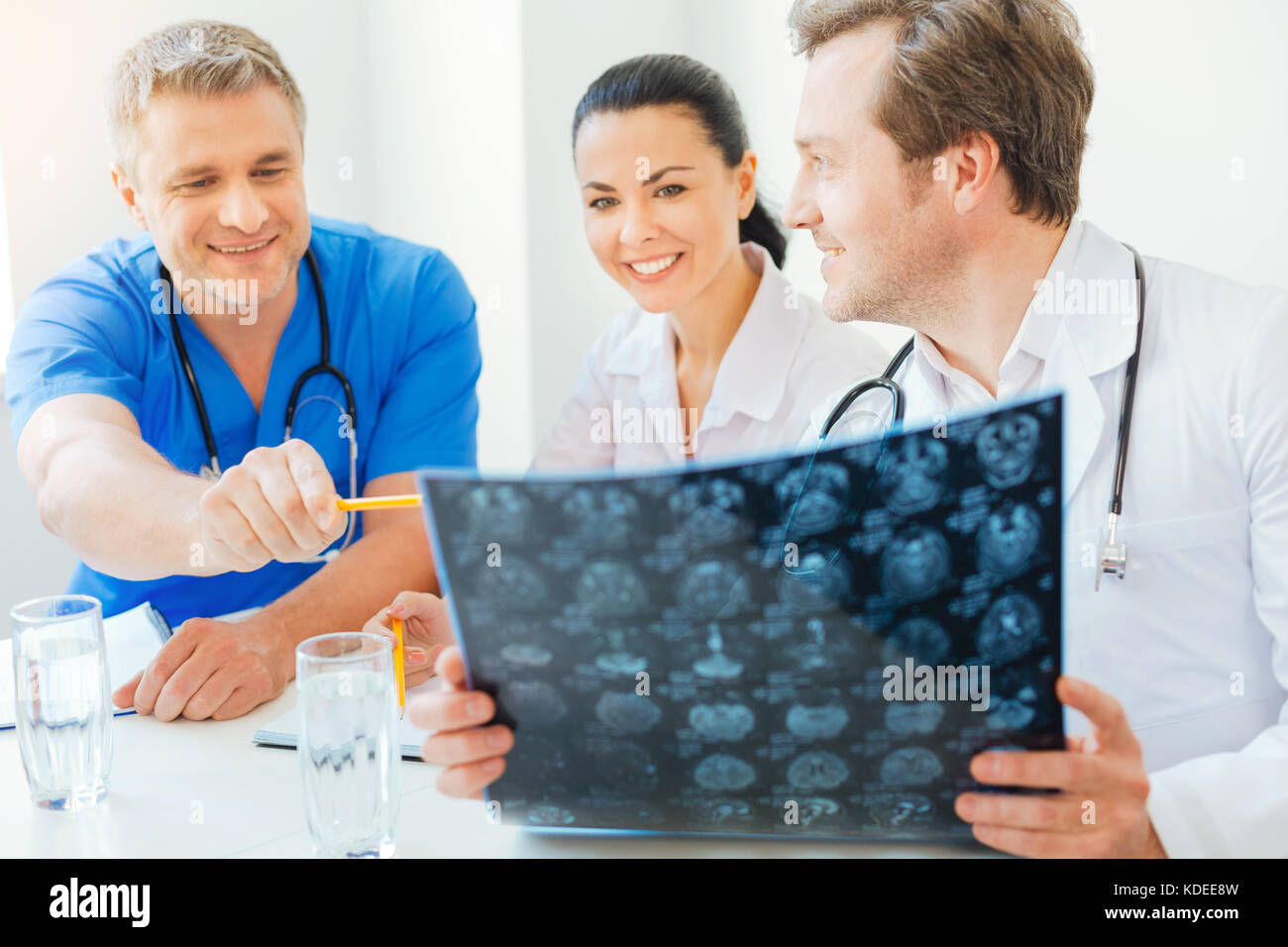 Satisfied radiologists talking about diagnosis of patient Stock Photo ...