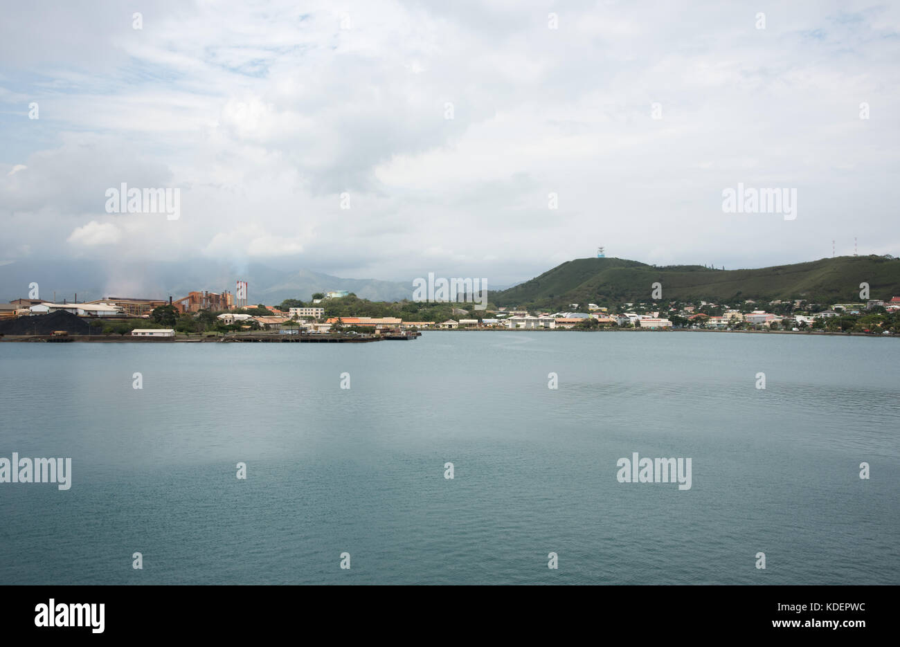 NOUMEA, NEW CALEDONIA-NOVEMBER 25,2016: SLN plant with smoke stack and waterfront architecture in Noumea, New Caledonia Stock Photo