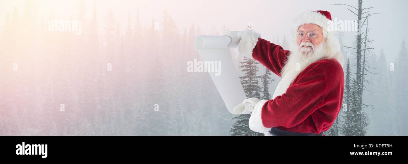 Digital composite of Santa Claus in Winter with list Stock Photo - Alamy