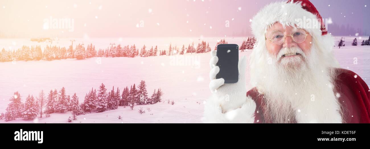 Digital composite of Santa Claus in Winter with phone Stock Photo - Alamy