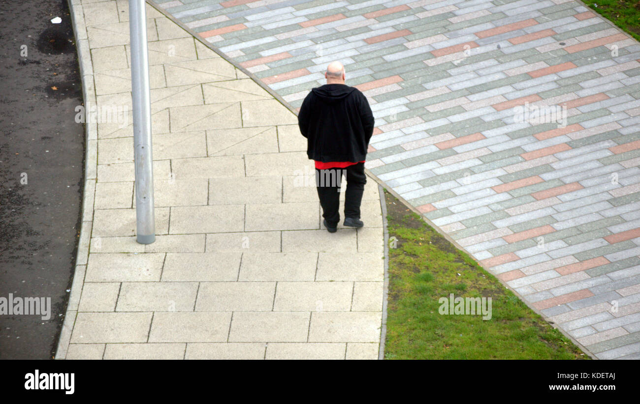 Queen Elizabeth University Hospital,Royal Hospital for Children, patients on path from above a fat  bald man Stock Photo