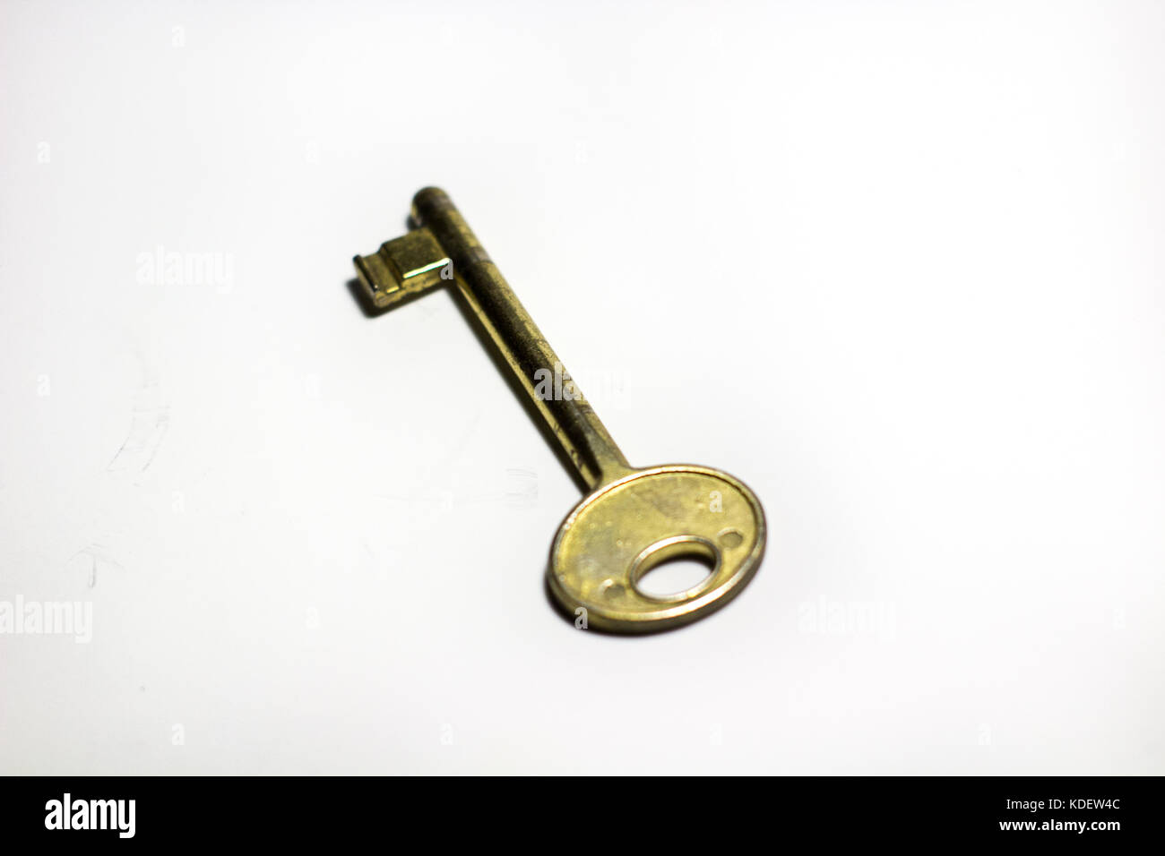 old vintage bronze key isolated on a white background Stock Photo - Alamy