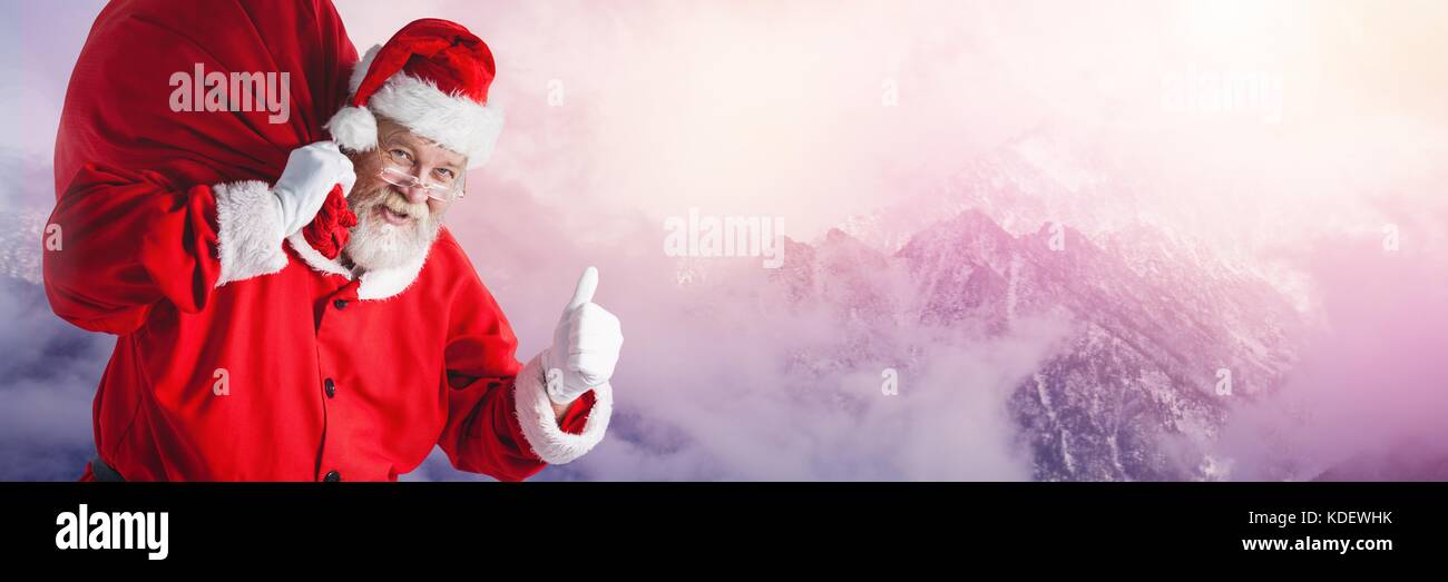 Digital composite of Santa Claus in Winter with sack Stock Photo - Alamy