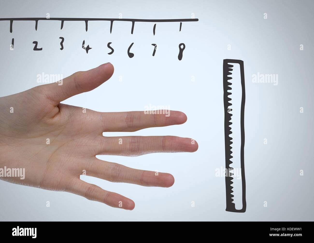 Digital composite of Rulers measuring size of long hand and fingers ...