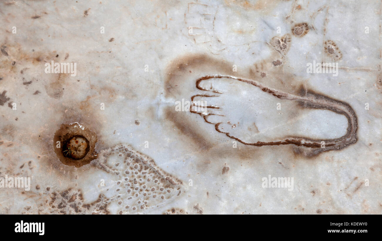 A foot carved on marble in front of the brothel in ancient Ephesus