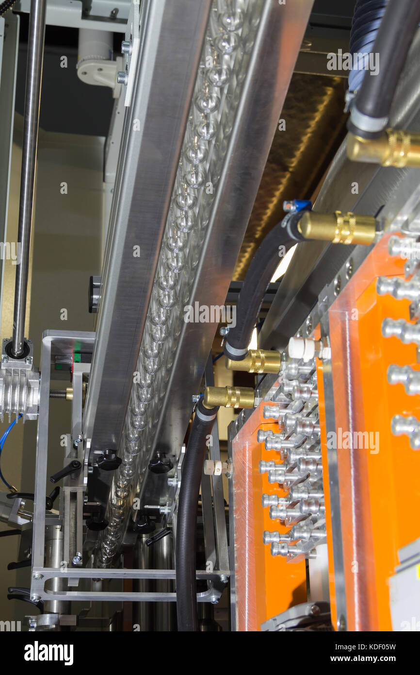 PET Preform in PET bottles blowing. The plastic bottle blowing machine