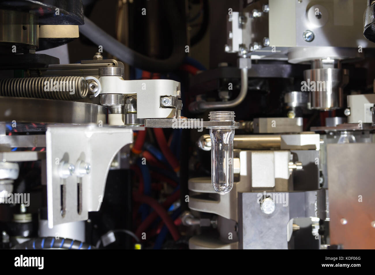 PET Preform in PET bottles blowing. The plastic bottle blowing machine