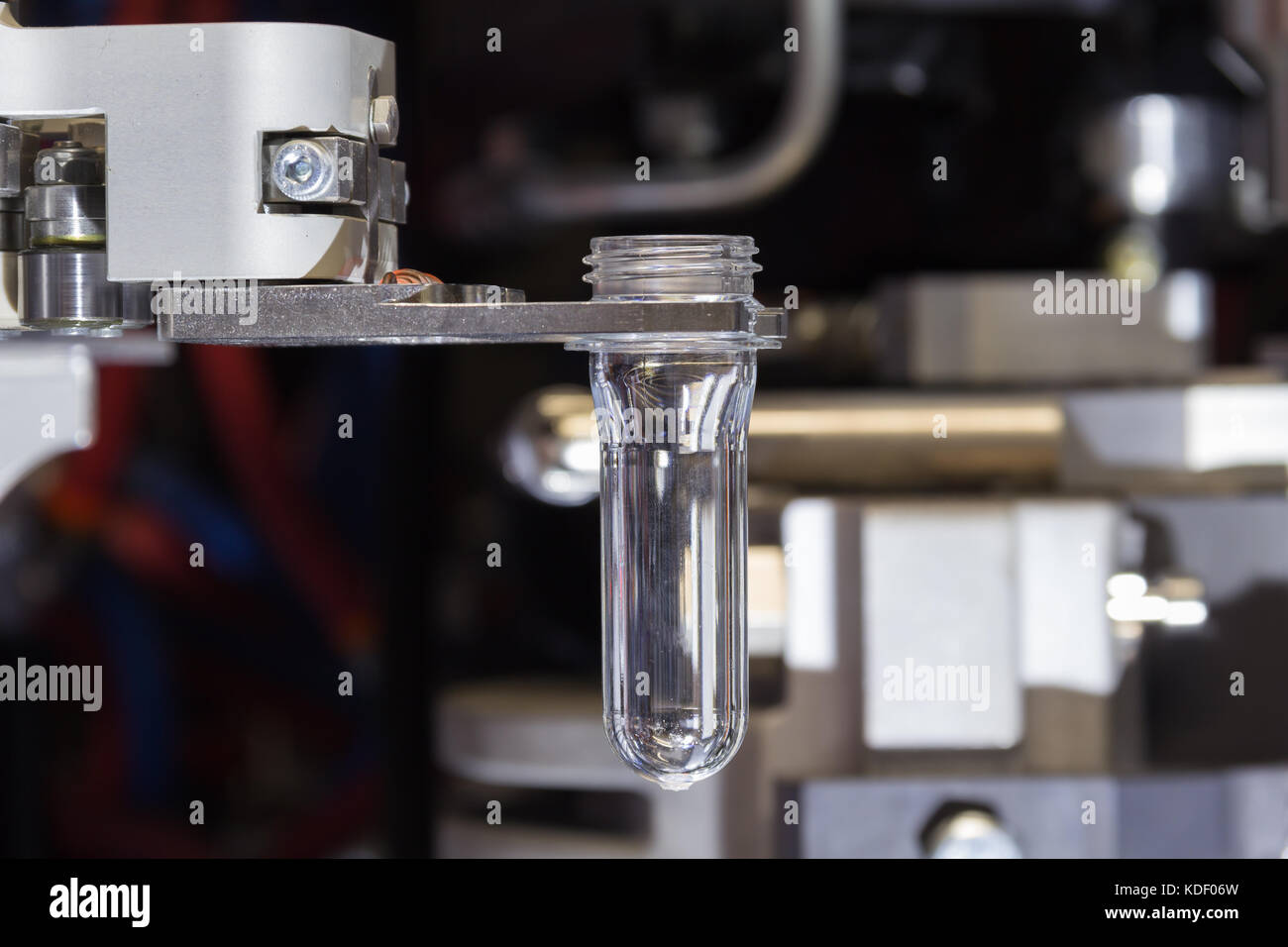 PET Preform in PET bottles blowing. The plastic bottle blowing machine
