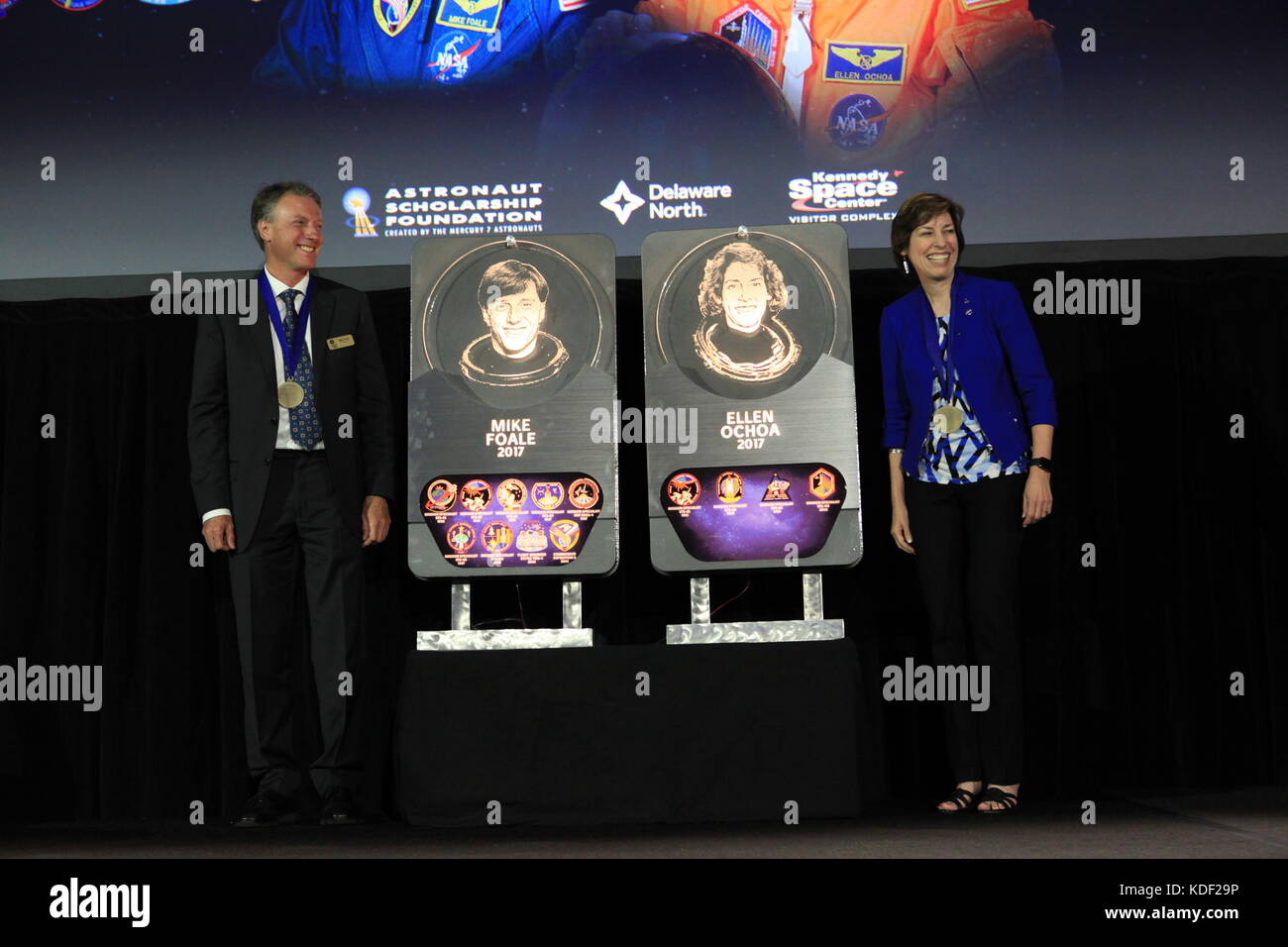 Former NASA space shuttle astronauts Michael Foale (left) and Ellen Ochoa pose with their plaques after being inducted into the U.S. Astronaut Hall of Fame at the Kennedy Space Center Visitor Complex Space Shuttle Atlantis Facility May 19, 2017 in Merritt Island, Florida.    (photo by Kim Shiflett  via Planetpix) Stock Photo