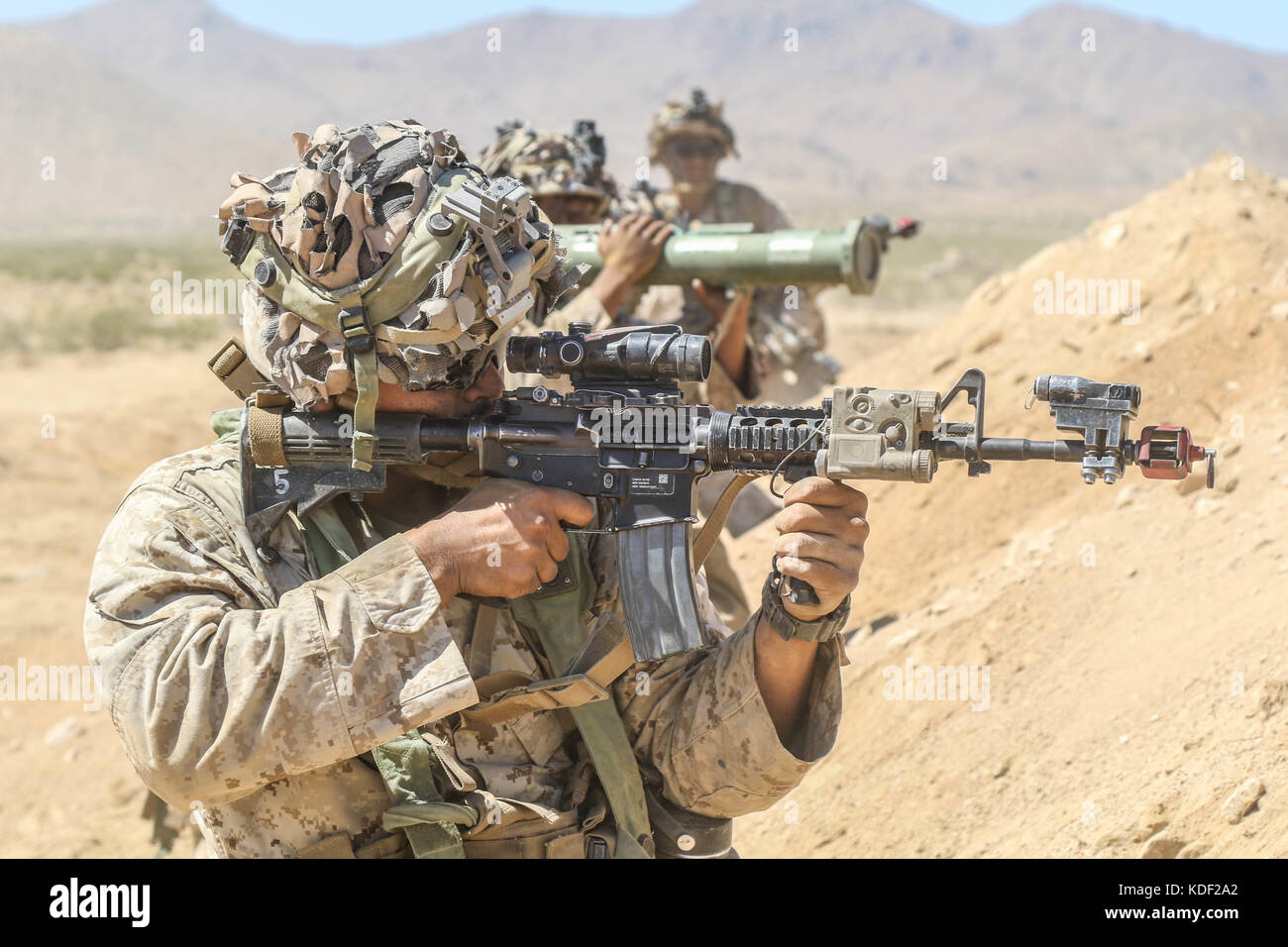 U.S. soldiers fire their weapons during an assault drill at the Fort Irwin National Training Center Alpine Pass June 30, 2017 in Fort Irwin, California.   (photo by Austin Anyzeski  via Planetpix) Stock Photo