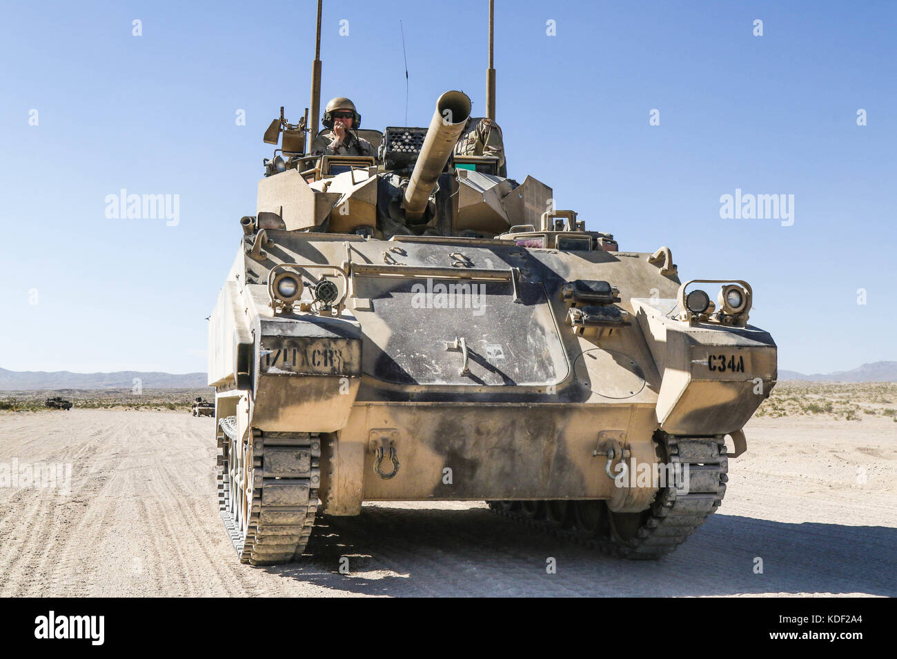 U.S. soldiers drive Opposing Force Surrogate Vehicles designed to replicate Russian military armored vehicles during assault training near the John Wayne Foothills at the Fort Irwin National Training Center July 1, 2017 in Fort Irwin, California.   (photo by Austin Anyzeski via Planetpix) Stock Photo