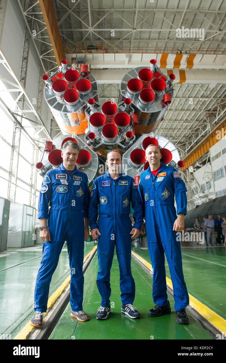 NASA International Space Station Expedition 52 prime crew members (L-R) Italian astronaut Paolo Nespoli of the European Space Agency, Russian cosmonaut Sergey Ryazanskiy of Roscosmos and American astronaut Randy Bresnik pose in front of the Soyuz MS-05 spacecraft booster rocket engines at the Baikonur Cosmodrome Integration Facility during their final pre-launch fit check dress rehearsal July 24, 2017 in Baikonur, Kazakhstan.   (photo by Andrey Shelepin  via Planetpix) Stock Photo