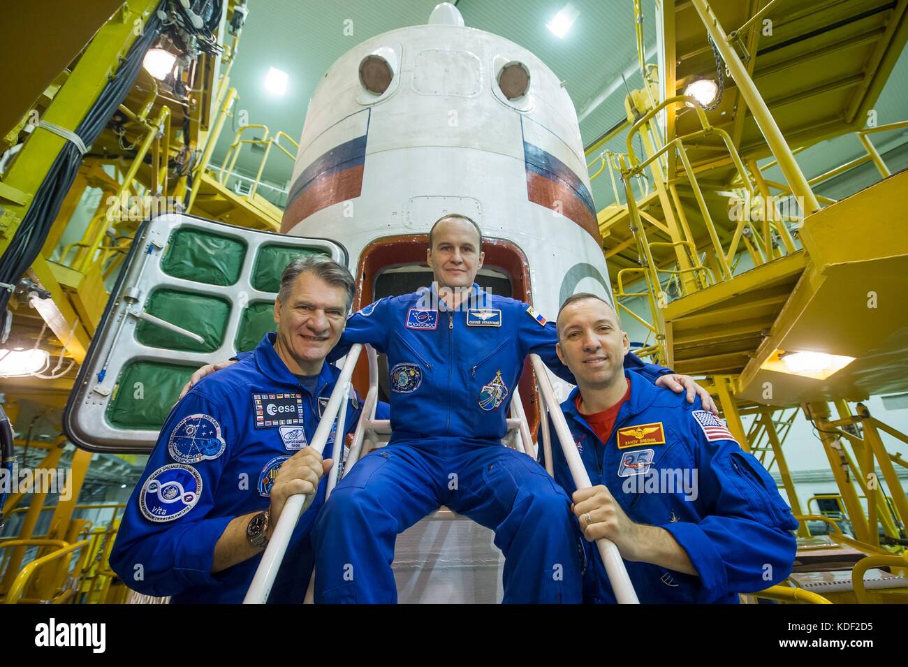 NASA International Space Station Expedition 52 prime crew members (L-R) Italian astronaut Paolo Nespoli of the European Space Agency, Russian cosmonaut Sergey Ryazanskiy of Roscosmos, and American astronaut Randy Bresnik pose in front of the Soyuz MS-05 spacecraft during their final pre-launch fit check dress rehearsal at the Baikonur Cosmodrome Integration Facility July 24, 2017 in Baikonur, Kazakhstan.    (photo by Andrey Shelepin  via Planetpix) Stock Photo