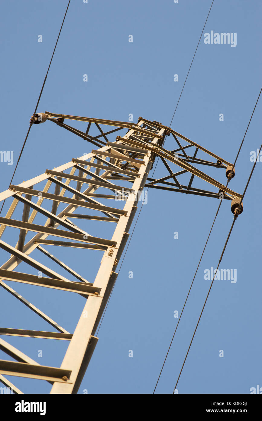 Electricity pylon against a blue sky Stock Photo - Alamy