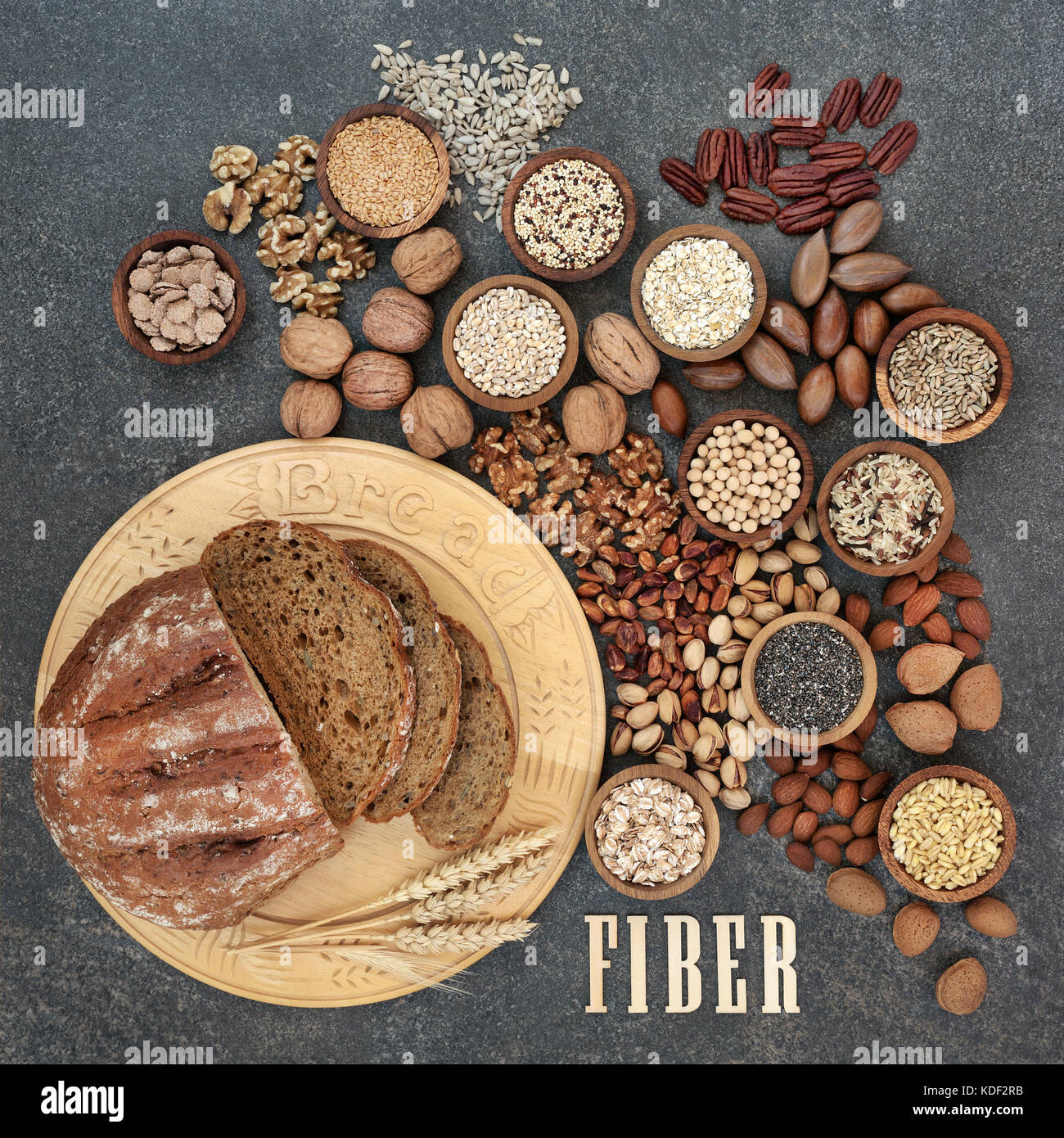 High fibre health food concept with fresh whole grain bread, nuts