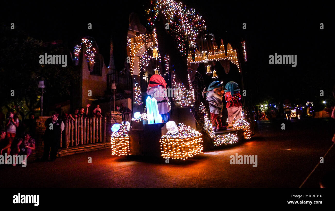 Magic Kingdom, princess parade, evening time fireworks, in Disney World, Florida, USA magical parade disney night time parade lights seven dwarfs Stock Photo