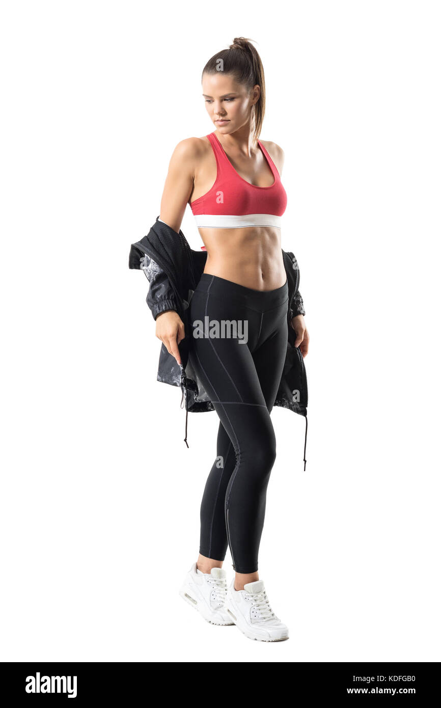 Fitness active woman in leggings taking off tracksuit jacket look back over  the shoulder. Full body length portrait isolated on white background Stock  Photo - Alamy