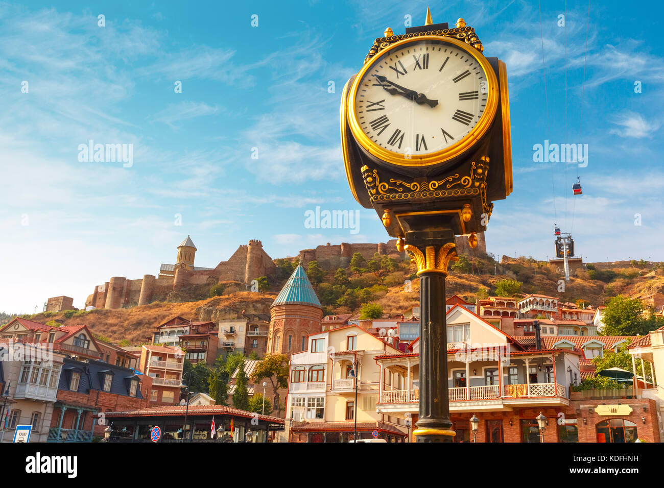 City clock and Narikala fortress, Tbilisi, Georgia Stock Photo