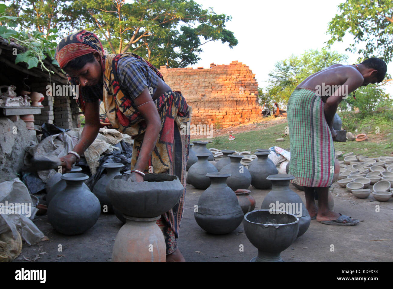 Khulna, Bangladesh Potter makes clay pot using a traditional wheel at