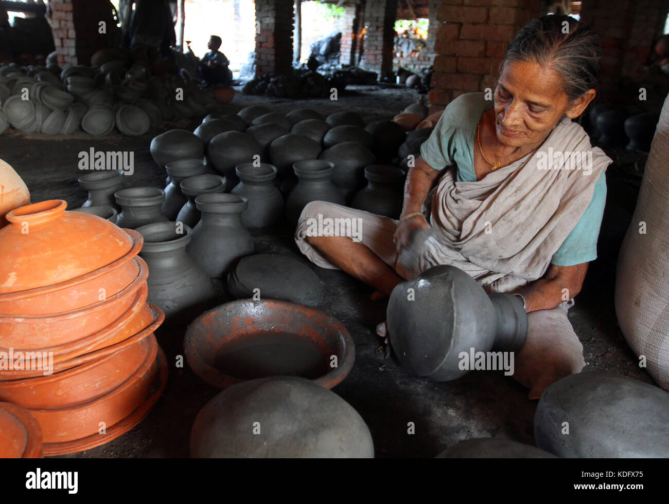Khulna, Bangladesh Potter makes clay pot using a traditional wheel at