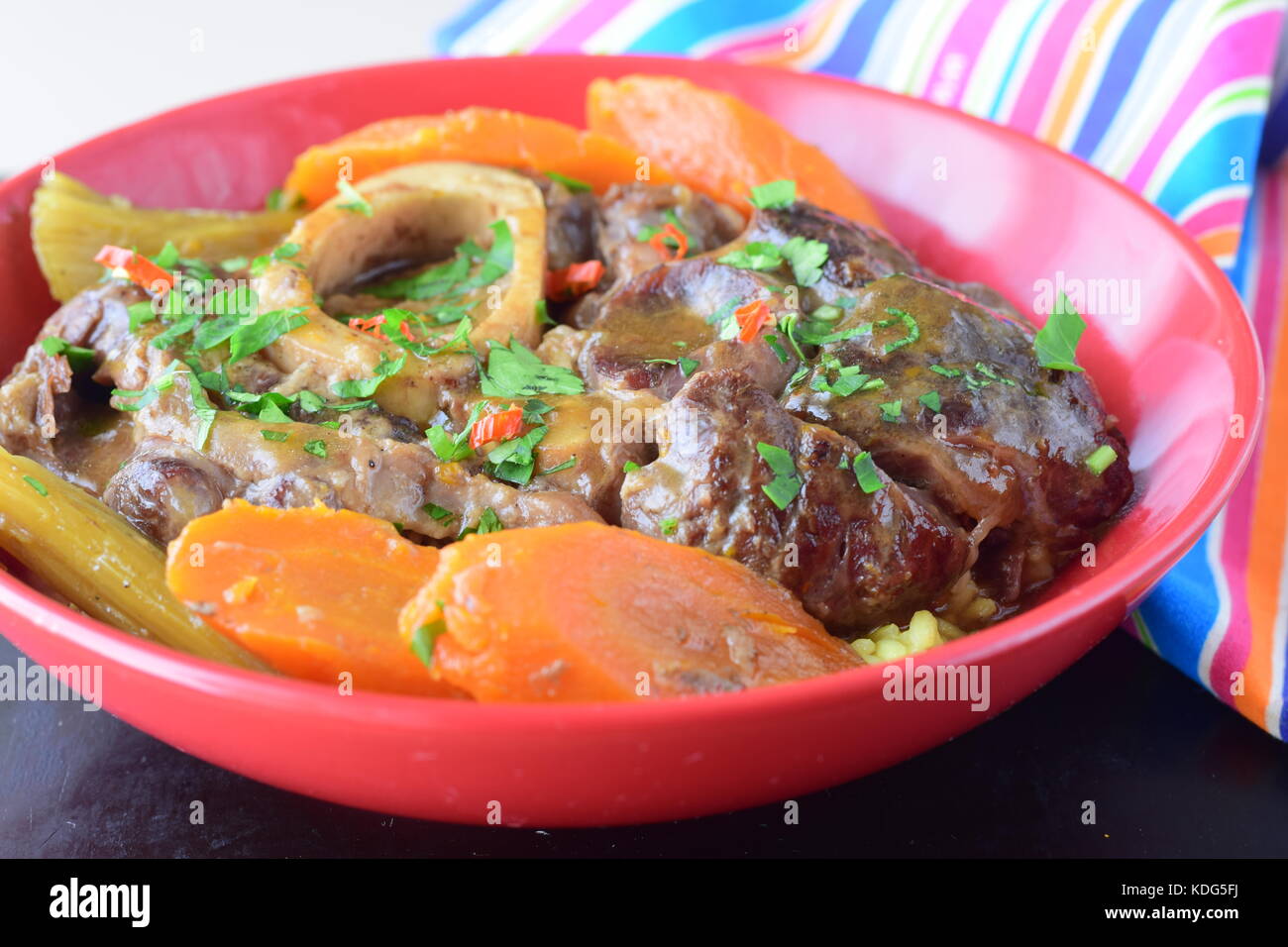 Italian traditional veal dish osso buco with cooked carrots, potato