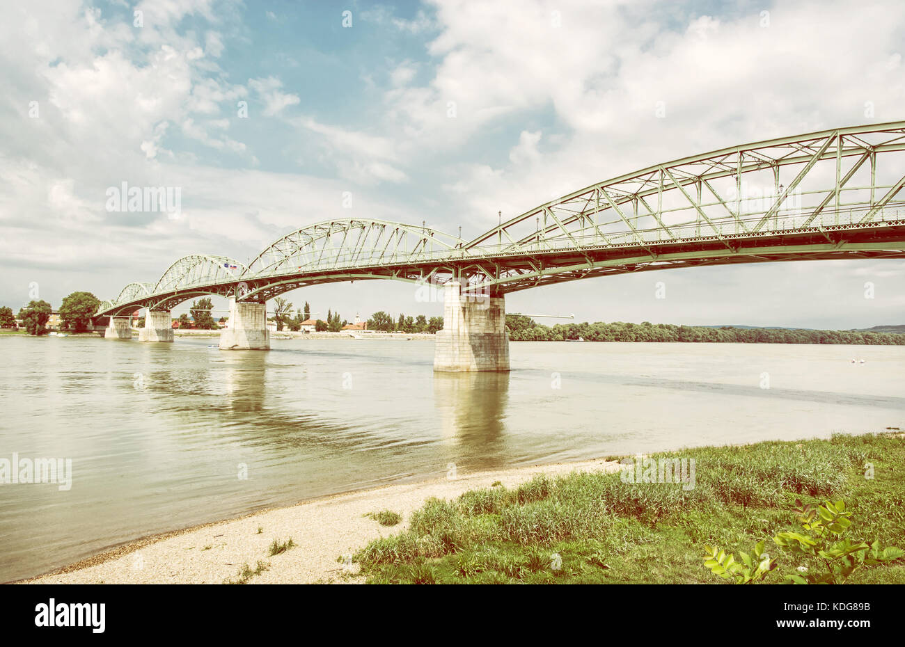Maria Valeria bridge joins Esztergom in Hungary and Sturovo in Slovak republic across the Danube river. Transportation theme. Architectural scene. Yel Stock Photo