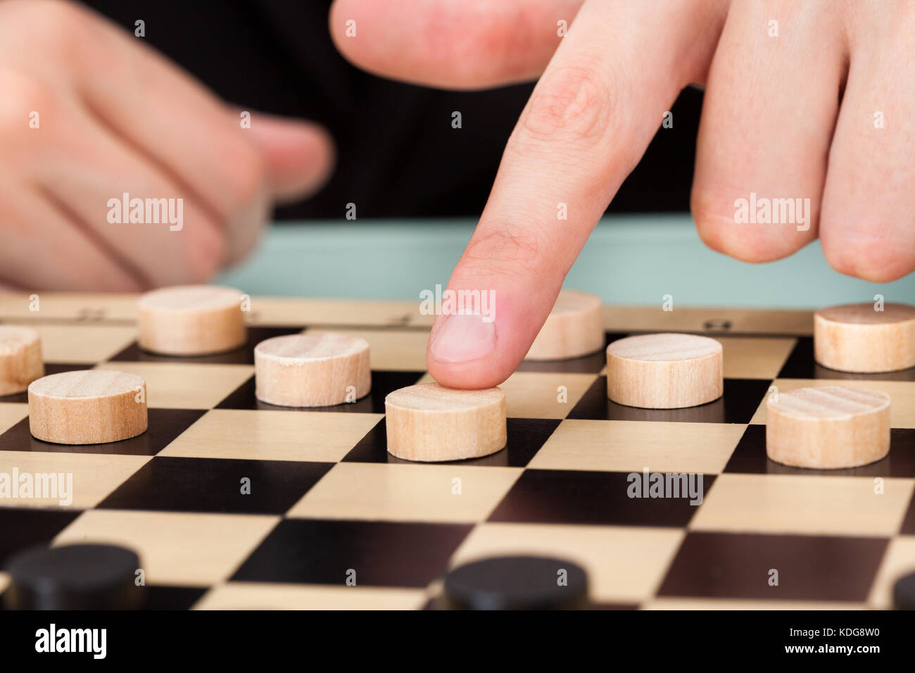 Close-up Businessman Playing Checkers At Office Desk Stock Photo