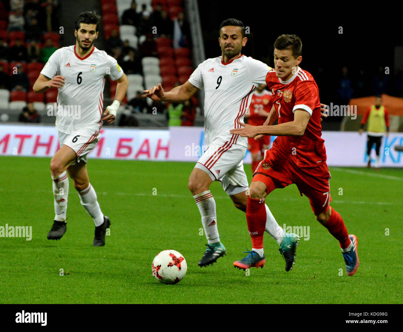 Kazan, Russia - October 10, 2017. Russian striker Dmitry Poloz and Iranian players Saeid Ezzatollahi and Omid Ebrahimi during international friendly m Stock Photo