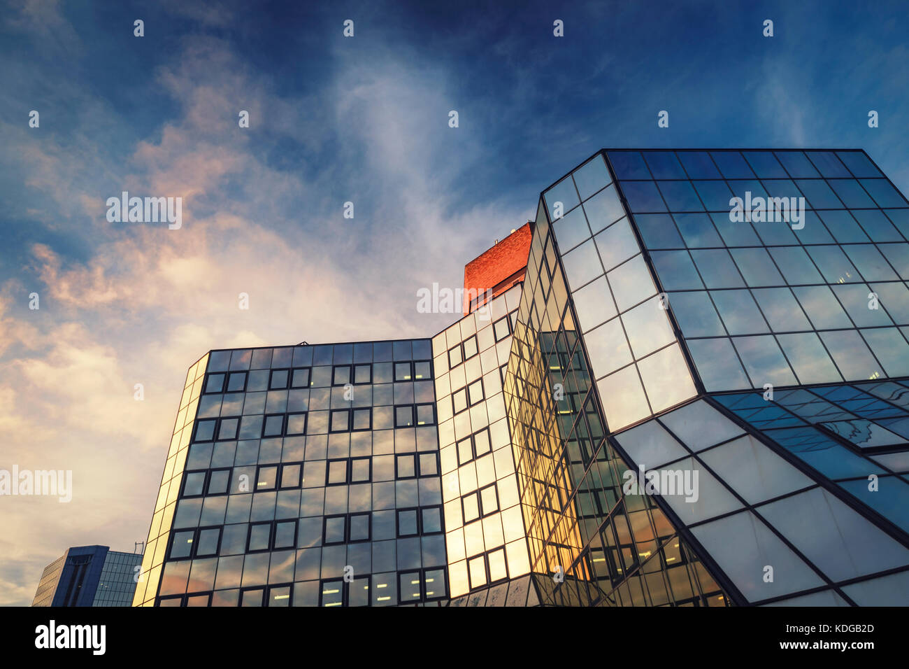 Sunset Clouds Reflections in Windows of Modern Office Building Stock Photo