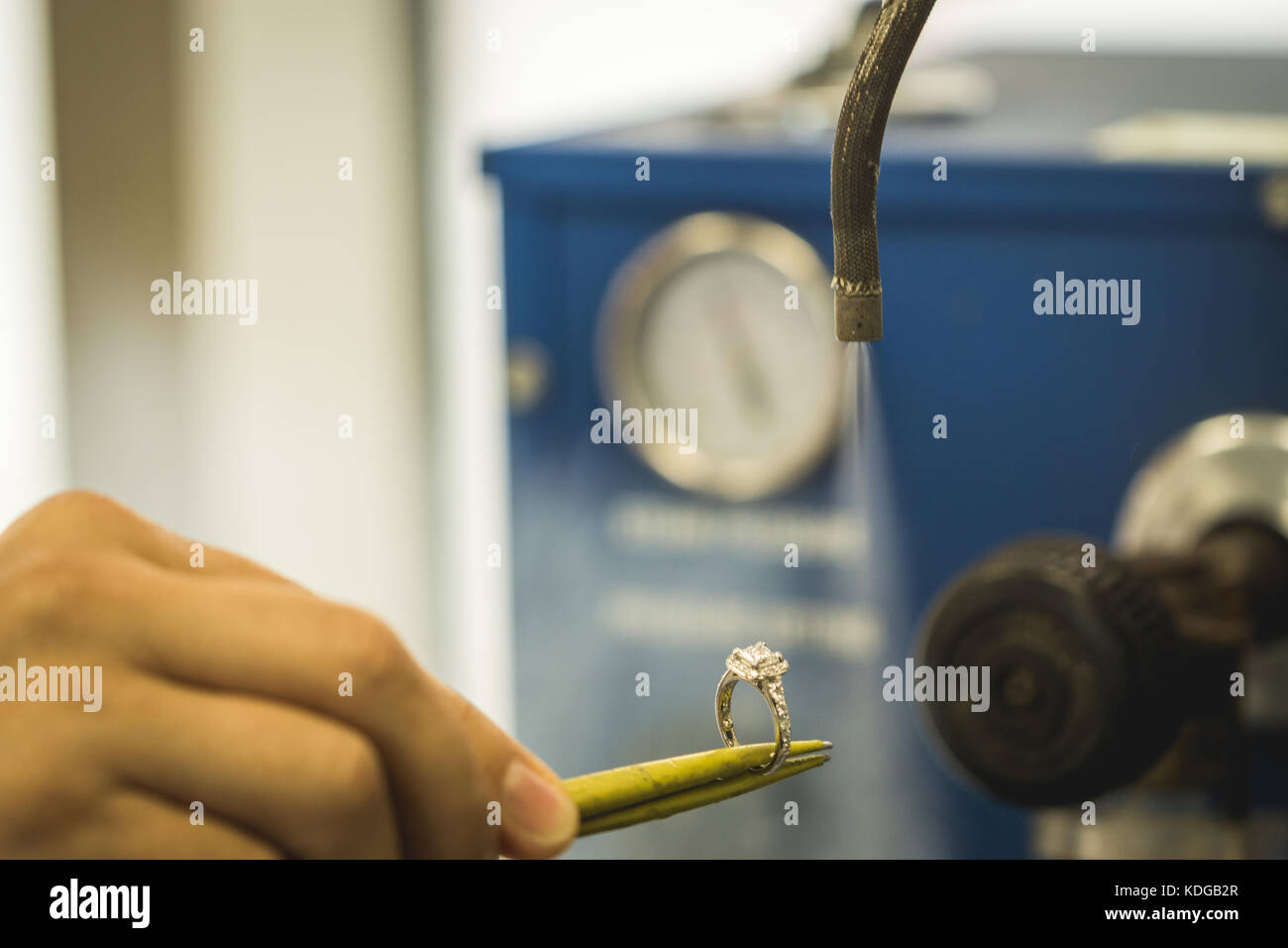 Cleaning of precious diamond ring in jewellery workshop Stock Photo